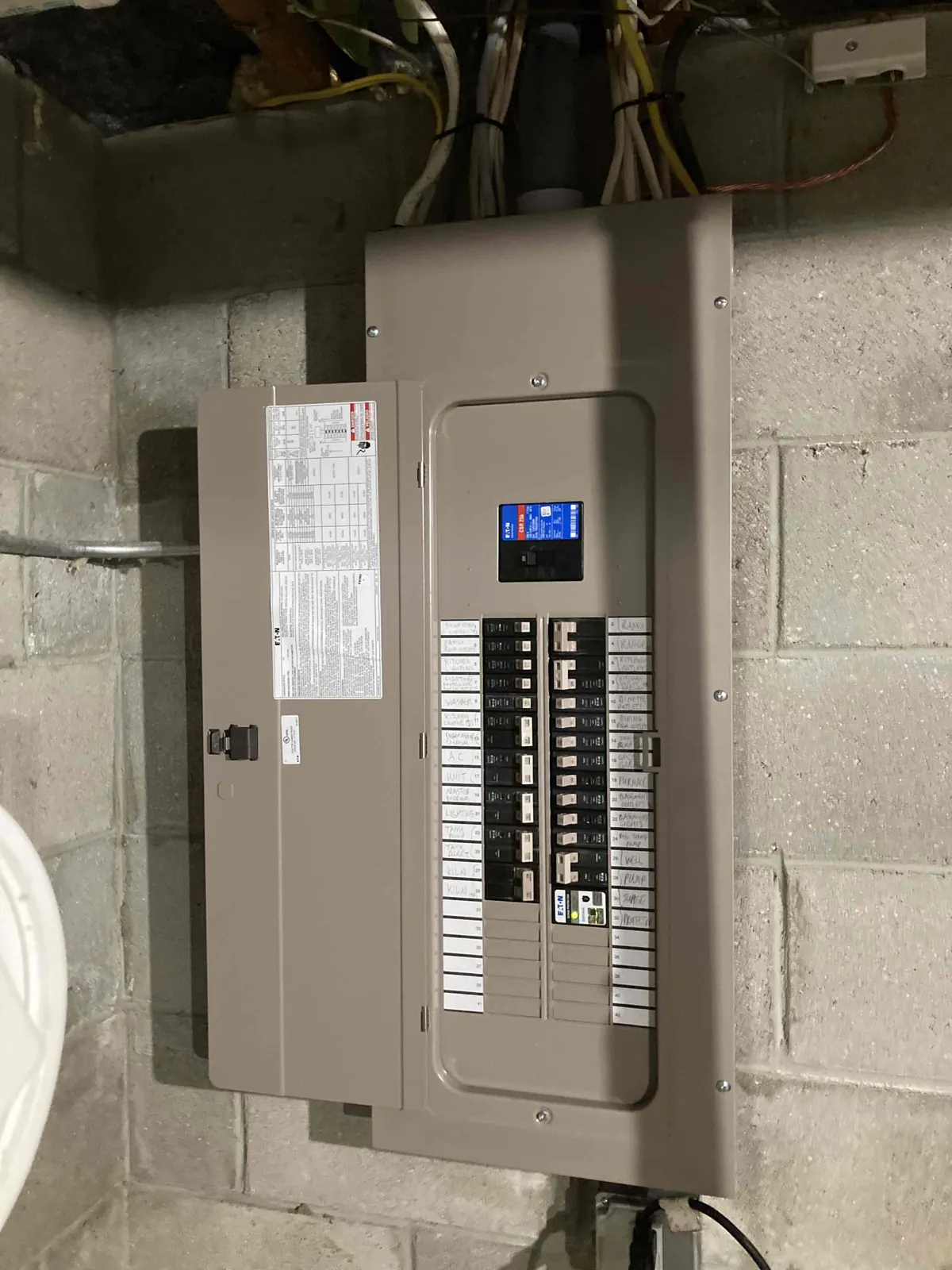AFTER: New electrical conduit and panel installed in Mukwonago — by Jim, O'Leary Plumbing, Heating & Electrical.
