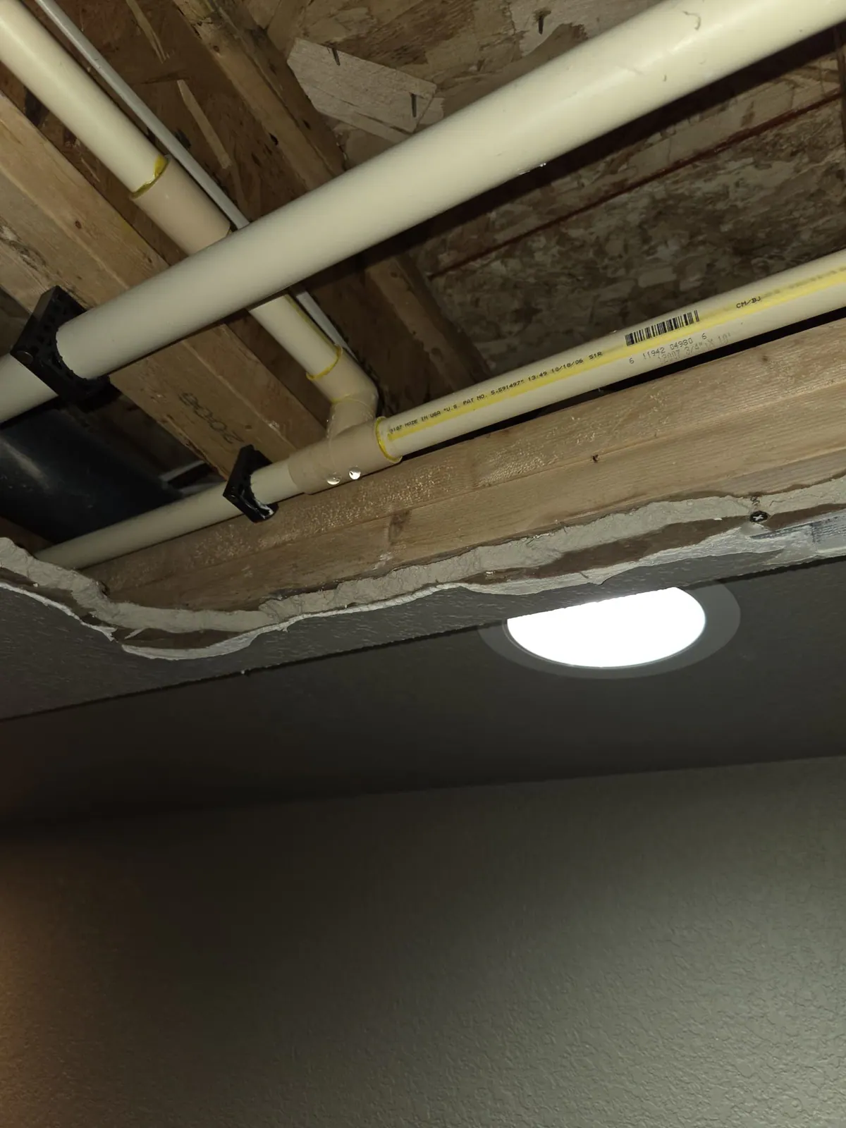 BEFORE: Active pipe leak at a home in Mukwonago — repair by Dan, O'Leary Plumbing, Heating & Electrical.