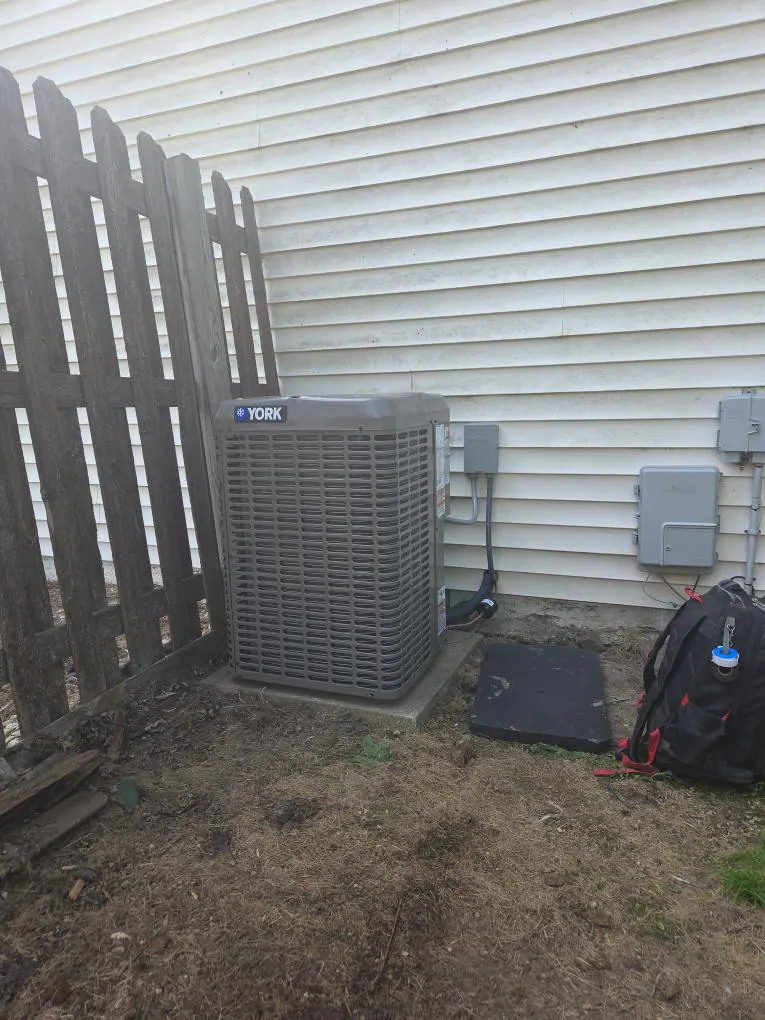 AFTER: New high-efficiency A/C condenser installed in Genoa City — by Cody & Kyle, O'Leary Plumbing, Heating & Electrical.