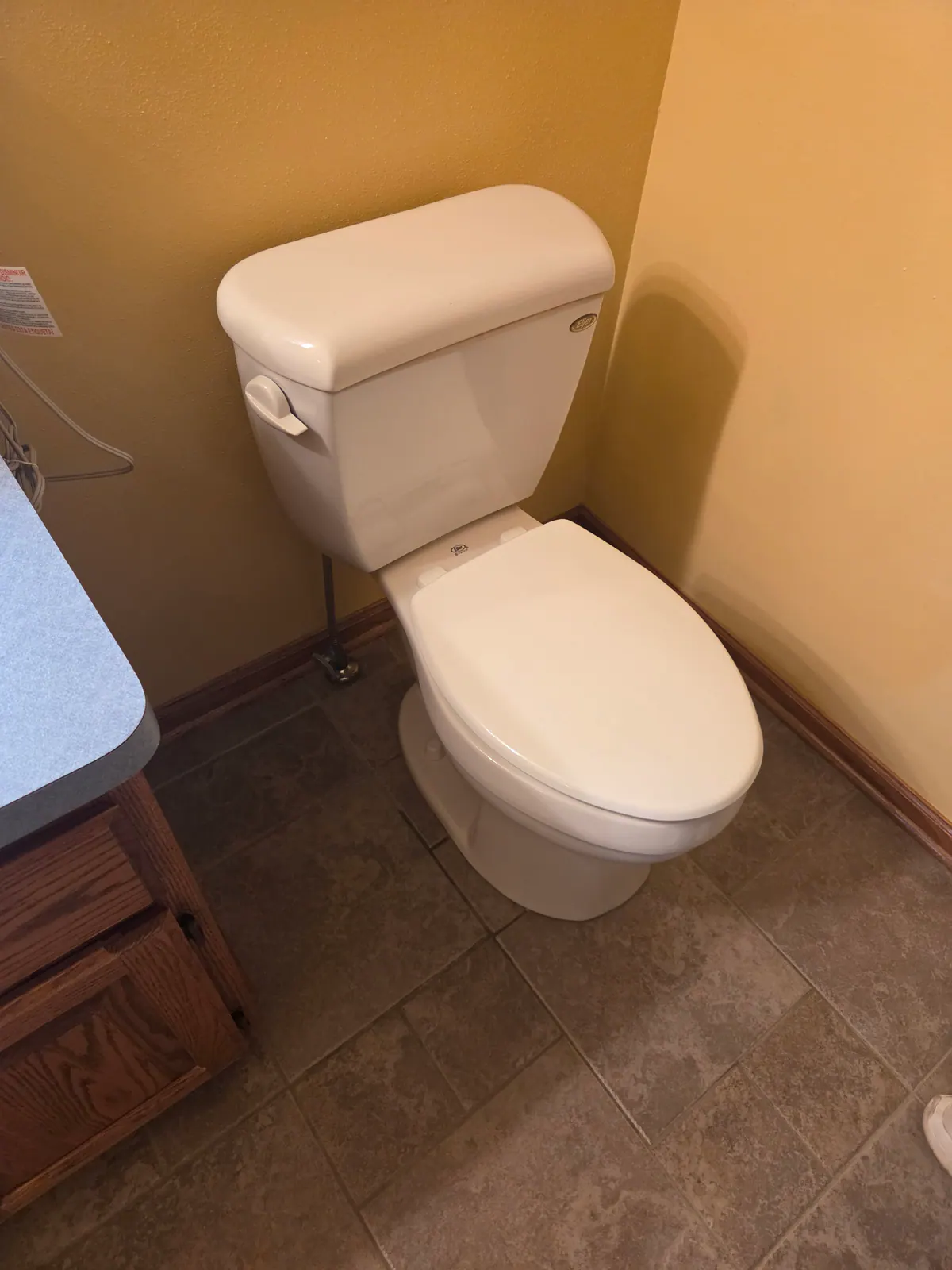 BEFORE: Old toilet ready to be removed at a home in Eagle — replacement install by Nathan, O'Leary Plumbing, Heating & Electrical.