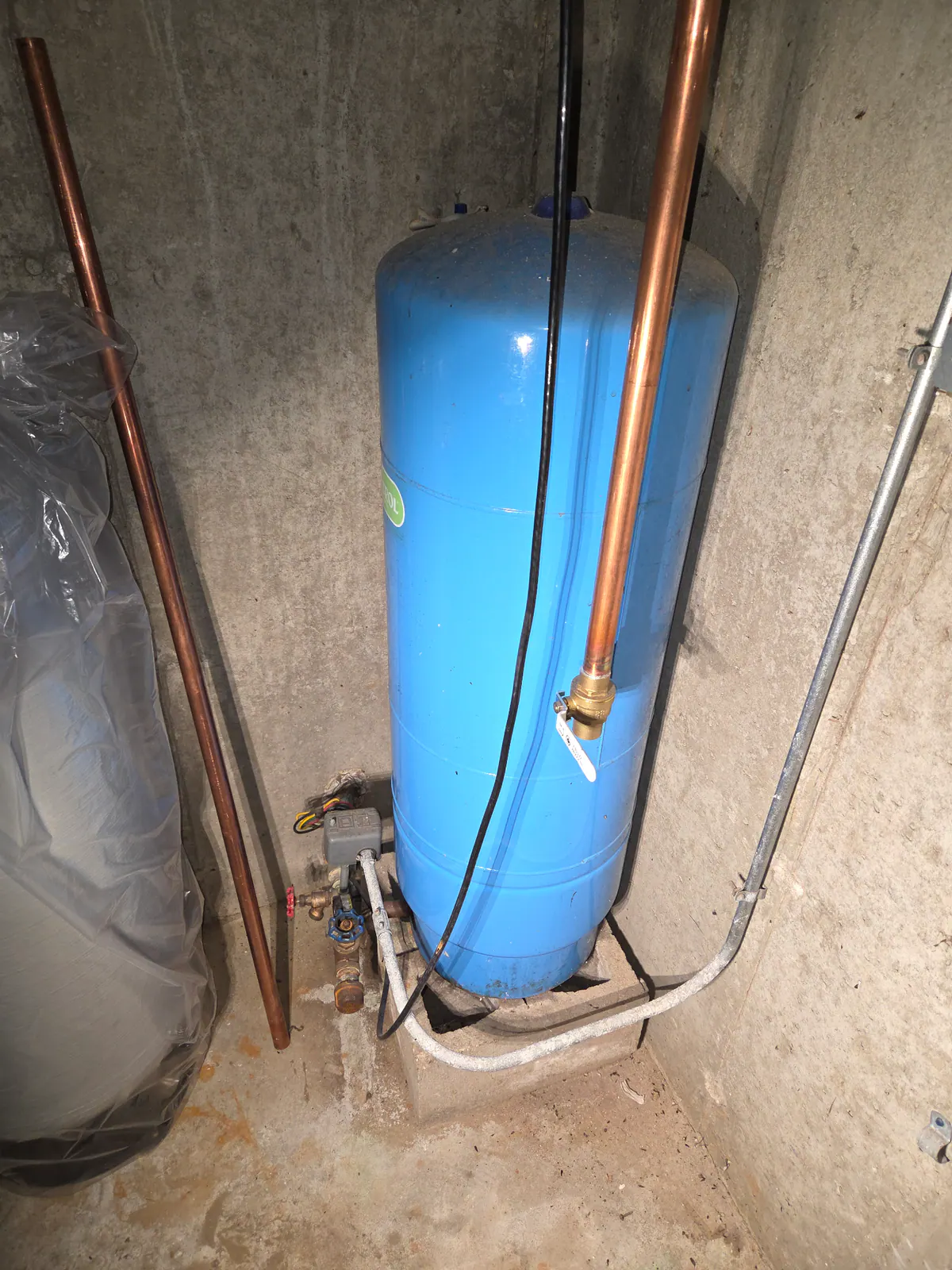 BEFORE: Old well pressure tank ready for replacement — by Dan, O'Leary Plumbing, Heating & Electrical.