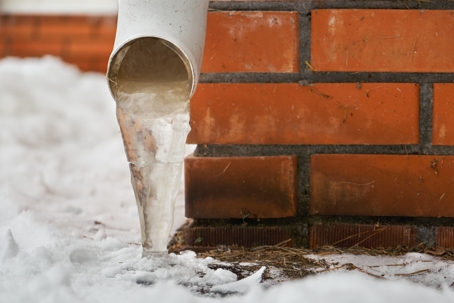 Drain pipe with frozen stream of water