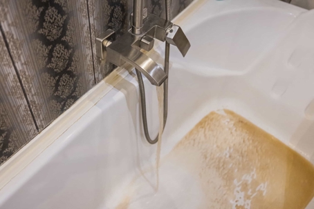 brown well water in bathtub