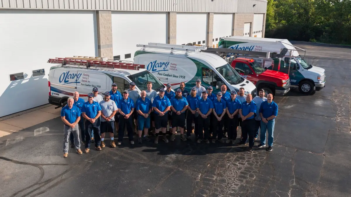 O'Leary Plumbing, Heating & Electrical service technicians and branded fleet